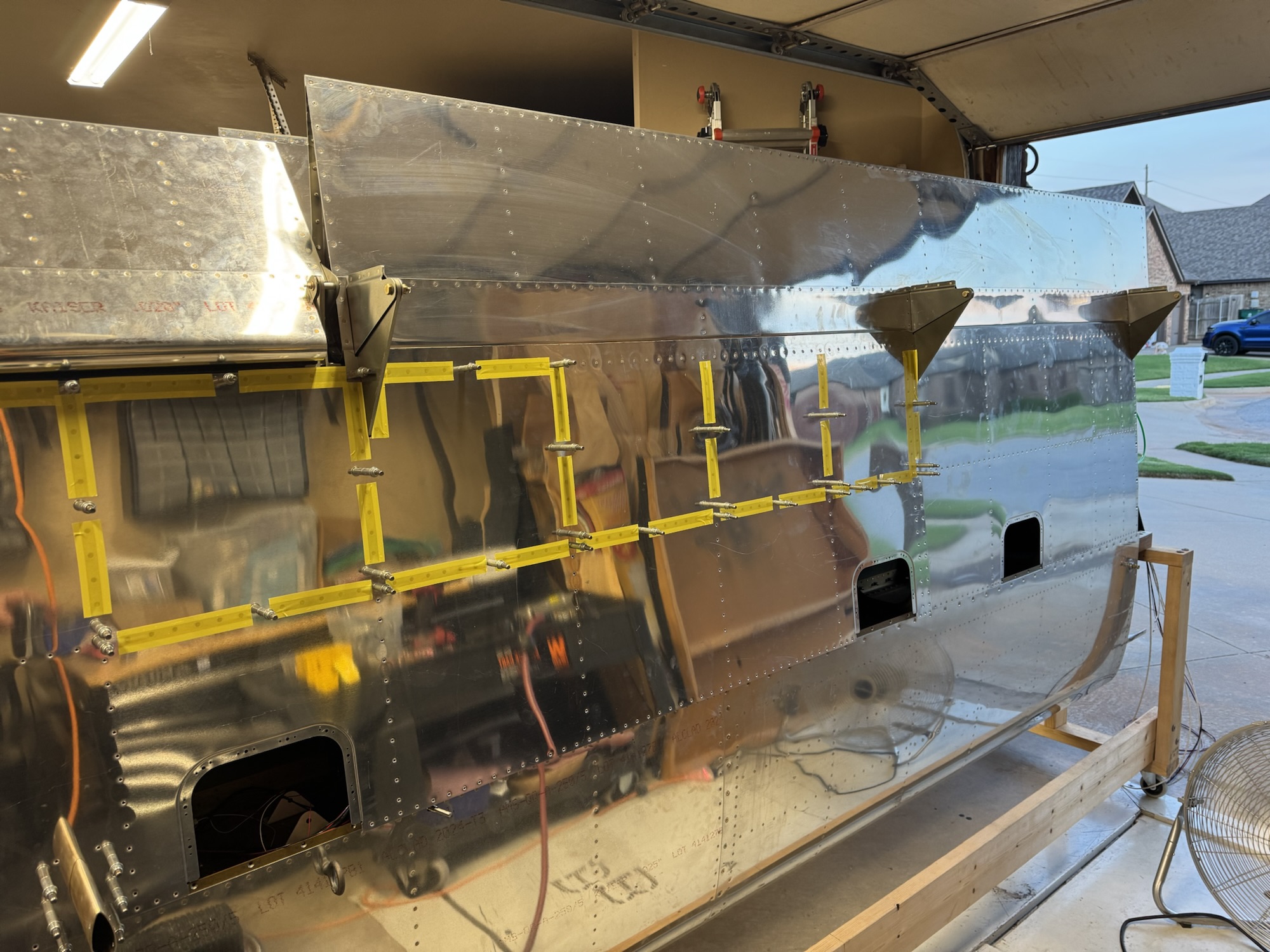 Wire Runs Complete, Left Flap Installed, and Bottom Skin Riveting Started
